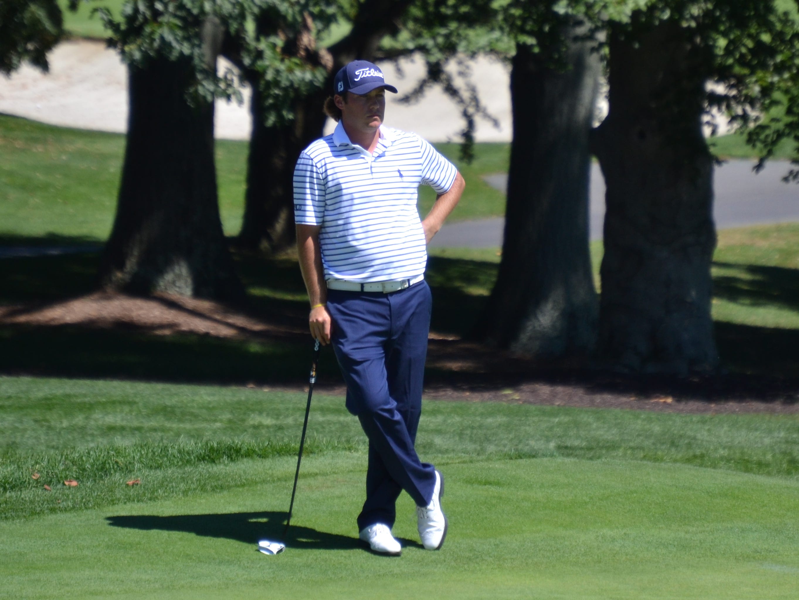 Mike Miller waits to put on the ninth green during the second round of the Met Open on Tuesday at Glen Oaks. The Brewster native dropped a birdie to close out a round of 2-under 68.