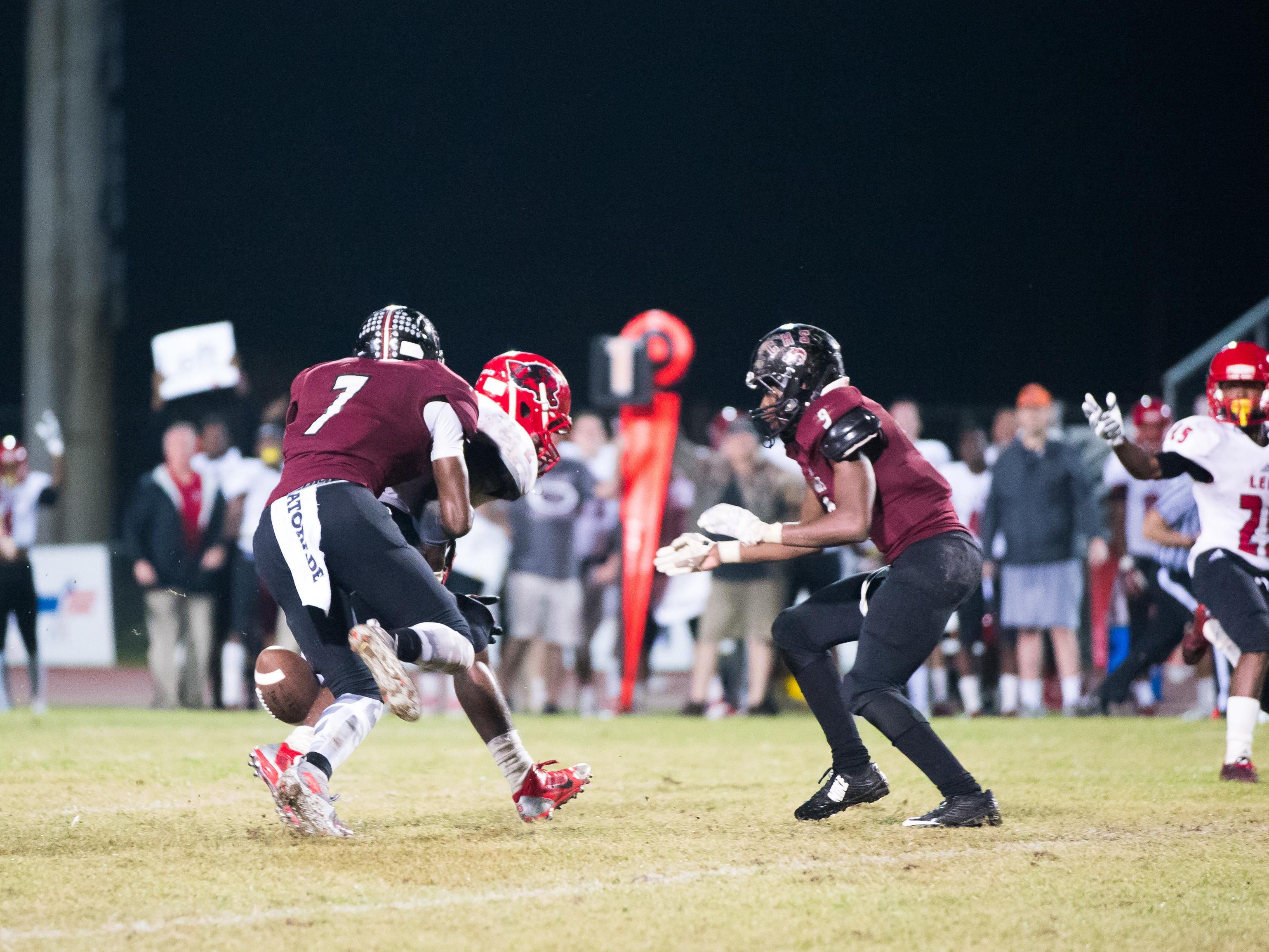 Chiles safety John Mitchell strips Leon running back James Peterson during a critical play during Monday’s three-way District 2-7A tiebreaker. The Timberwolves recovered, stopping a potential game-winning drive by the Lions.
