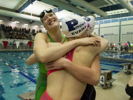 New state record holder Linsday Stone left, hugs her