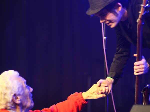 Rev. Robert K. Denny shakes the hand of Count the Stars bass player Jake Laughman after a concert at The Underground. Denny’s granddaughter Julia is a singer/violin player in the band.