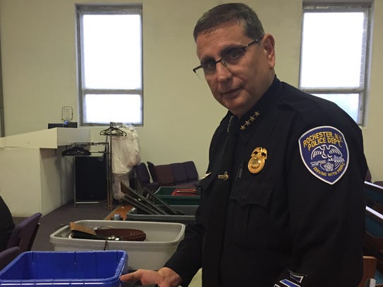 Rochester Police Chief Michael Ciminelli displays a