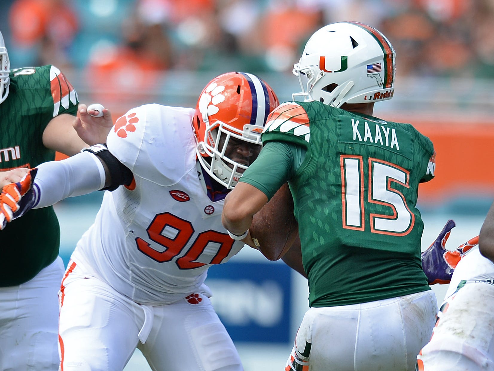 Clemson defensive end Shaq Lawson (90) bears down on Miami quarterback Brad Kaaya (15) to sack him during the 2nd quarter Saturday, Oct. 24, 2015, in Miami Gardens, Fla. The hit knocked Kaava out of the game.