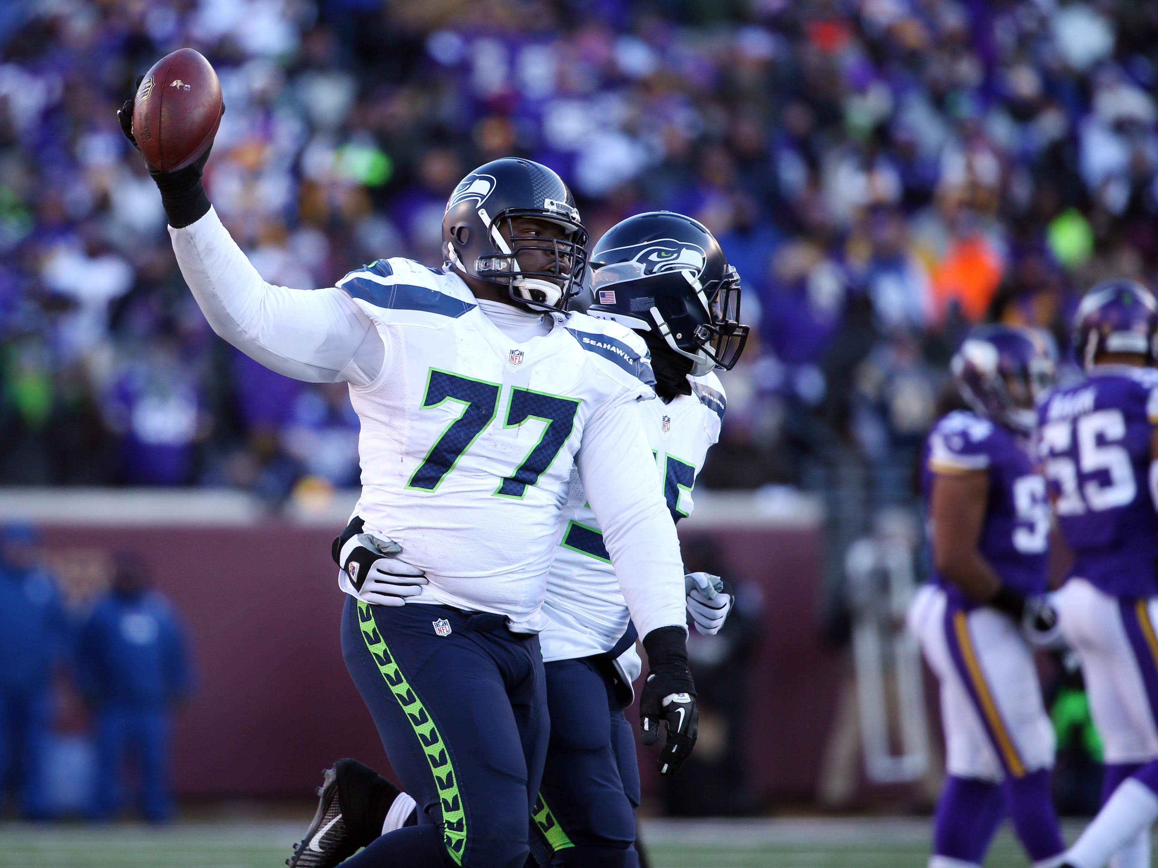 Seattle Seahawks defensive tackle Ahtyba Rubin (77) celebrates after a recovered fumble against the Minnesota Vikings in the fourth quarter of their NFC Wild Card playoff football game Jan. 10 at TCF Bank Stadium.