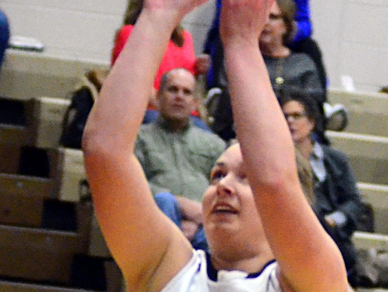 Hendersonville High senior forward Elizabeth Burns shoots an interior shot during first-quarter action. Burns – who scored two points – started the game on senior night after missing the entire season prior to Friday with a knee injury.