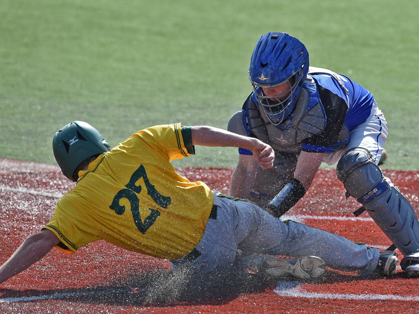 Bishop Manogue’s Chase McAninch is tagged out at home plate by Carson’s Kyle Krebs during the Northern Division I Region tournament at Peccole Park on Thursday.