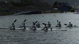 Athletes compete in a men's kayak four 1000  semifinal