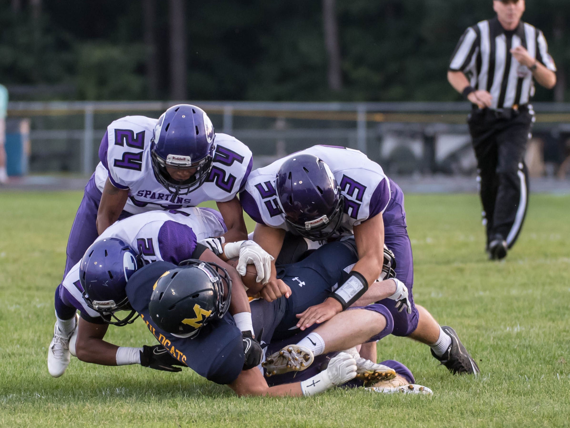 Lakeview's defensive players stop Mattawan Friday evening.