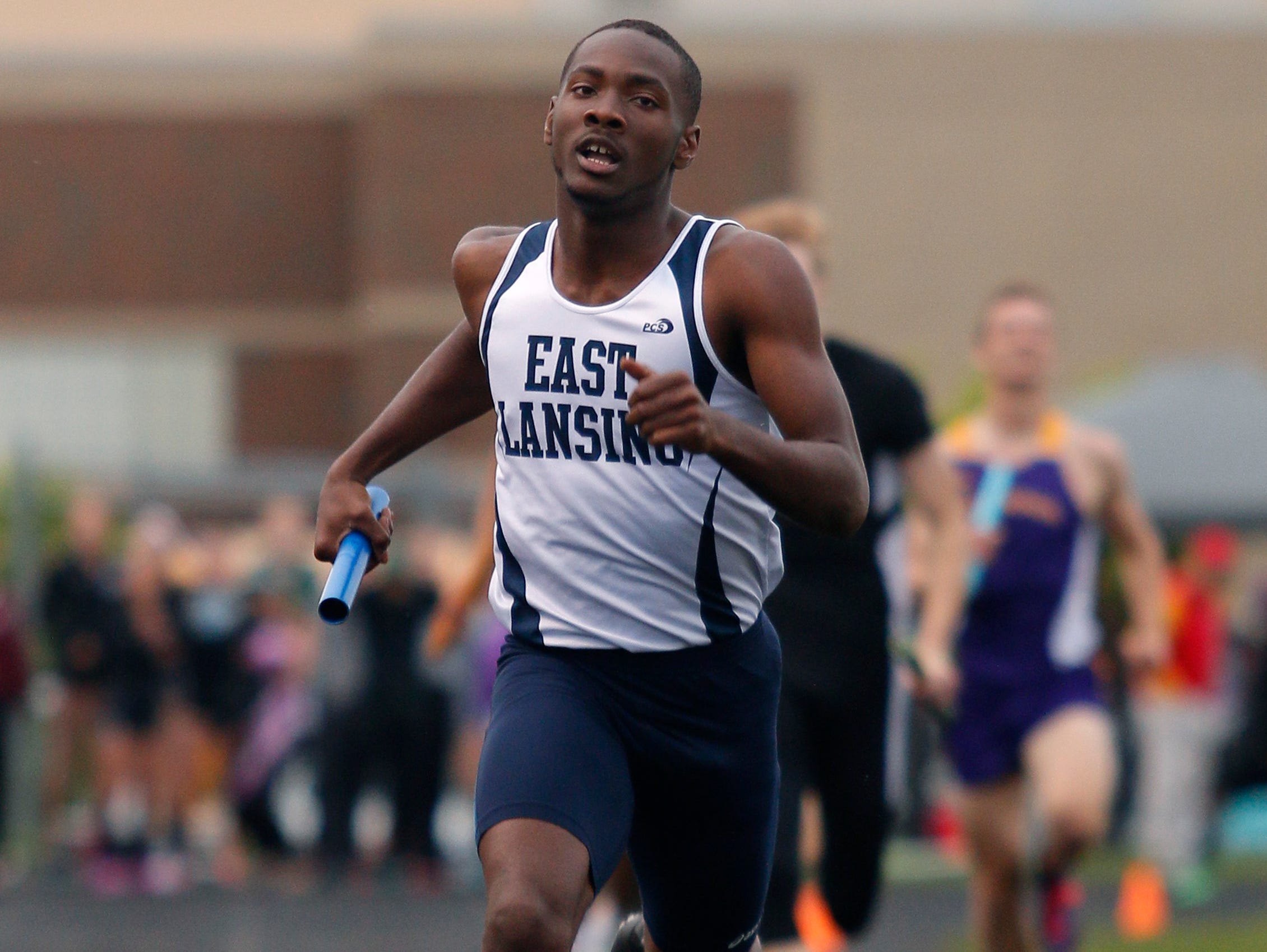 East Lansing's Kentre Patterson runs in the 4x400 meter relay Friday, May 20, 2016, in Holt, Mich.