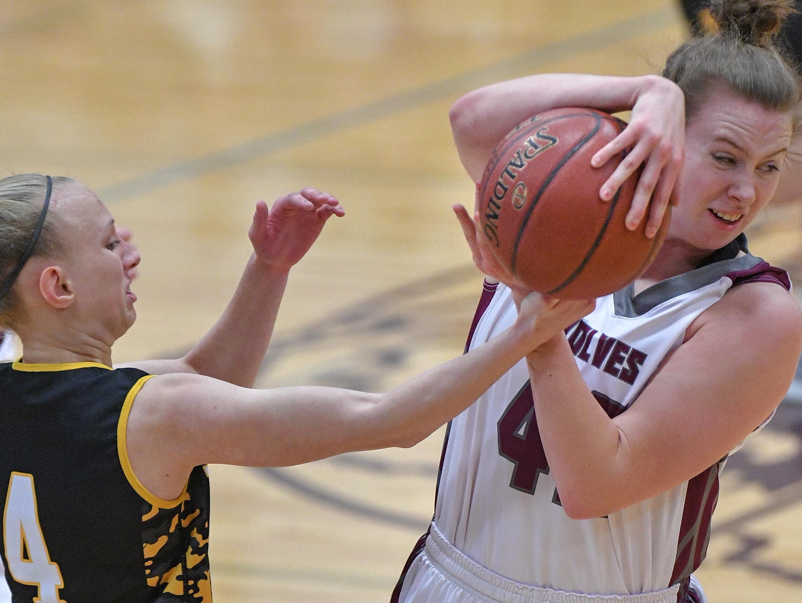 Sadie Kosciuk, right, of Winneconne tries to keep Tiana Gaubatz of Waupun from stealing the ball Thursday in Winneconne.