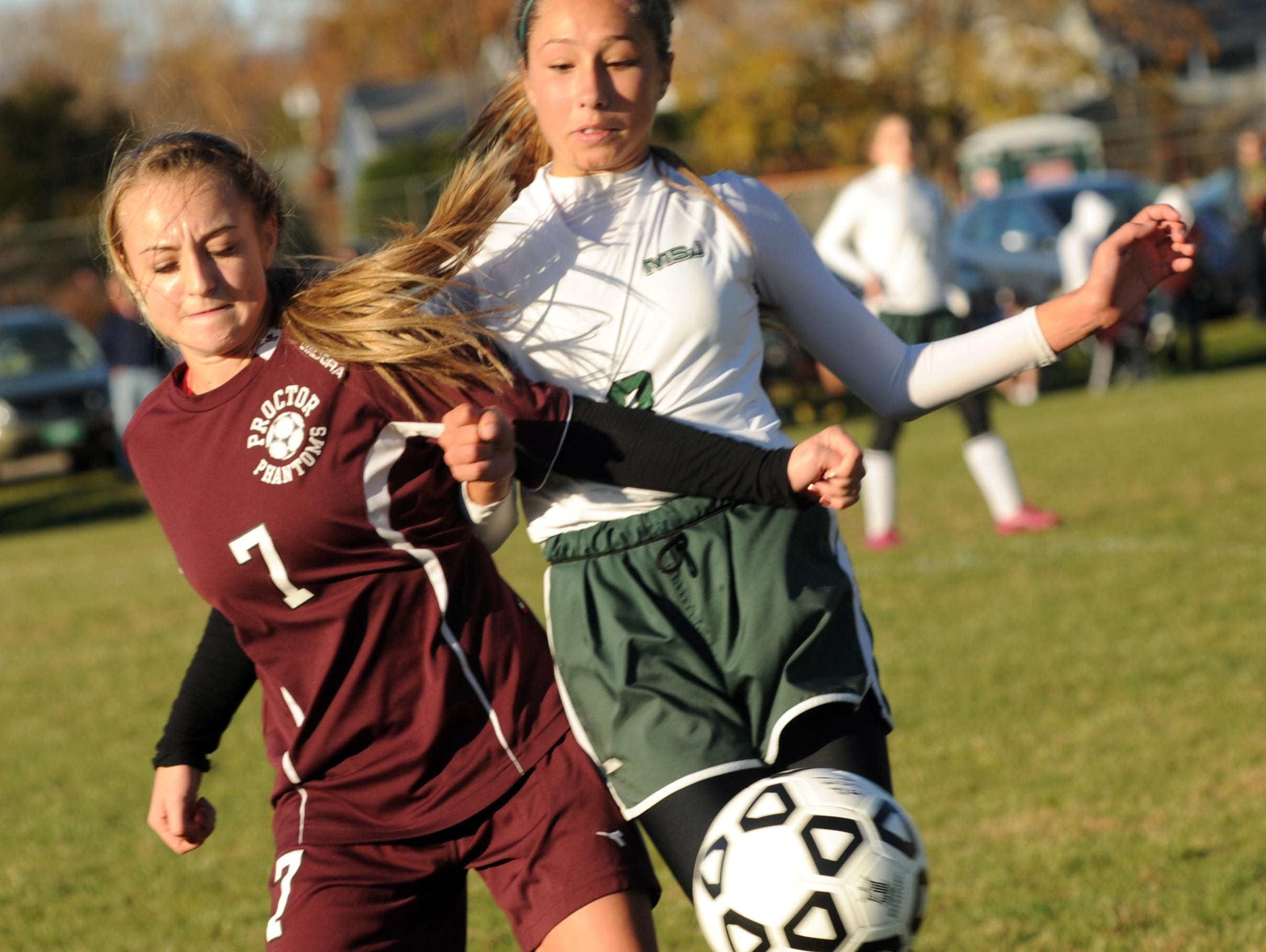 Proctor's Abby McKearin (7) and MSJ's Megan Eaton (8) get all tied up chasing after a loose ball during a 2013 playoff game in Rutland.