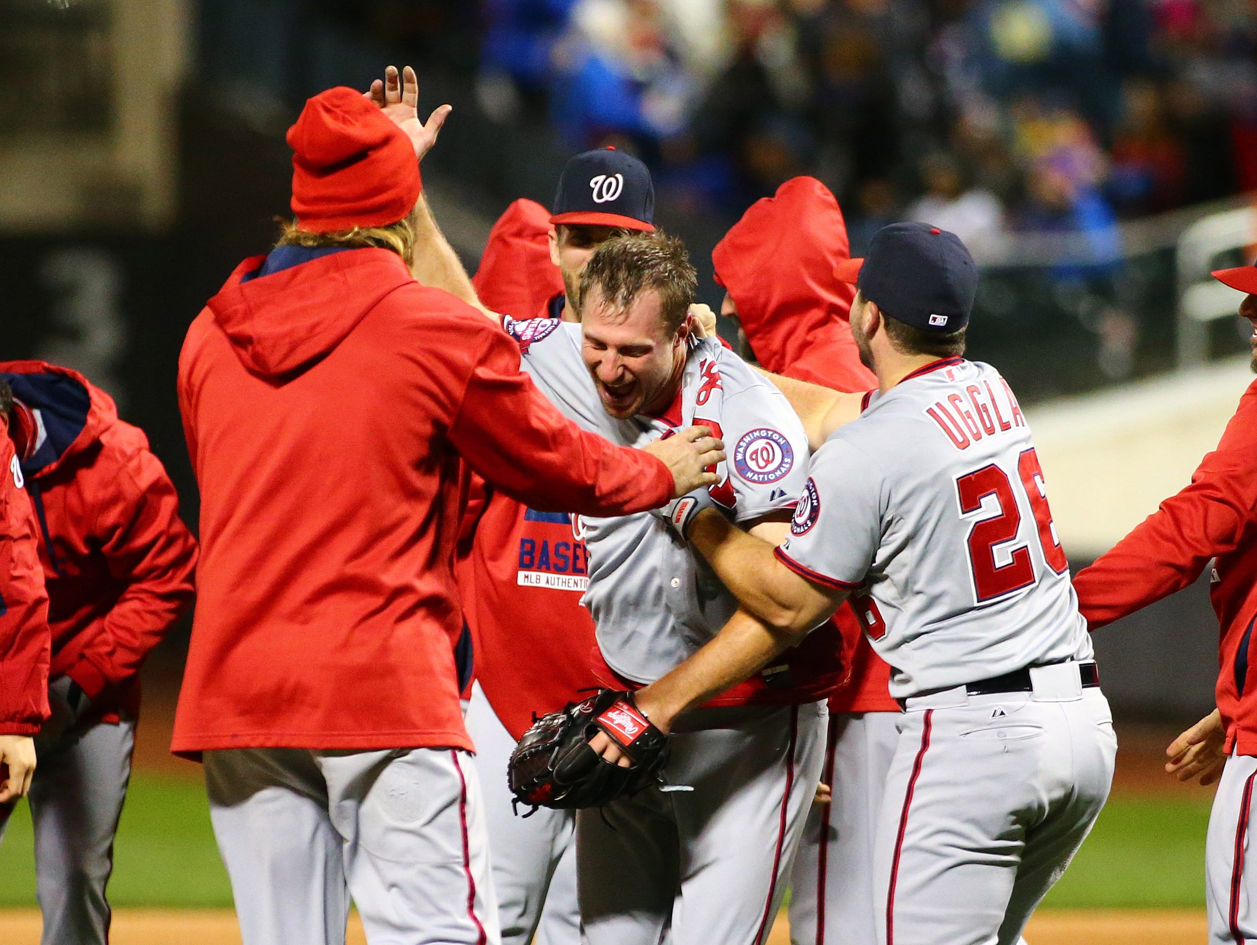 Washington Nationals starting pitcher Max Scherzer (middle) celebrates with his teammates after pitching a no hitter against the New York Mets during game two at Citi Field.