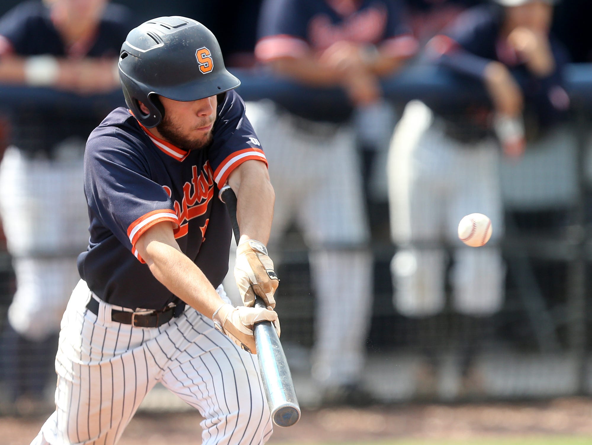 Summit's Wade Lopicolo (21) bunts during Game 11 of the 2016 TSSAA Class AAA State Baseball Tournament against Siegel on Thursday, May 26, 2016.