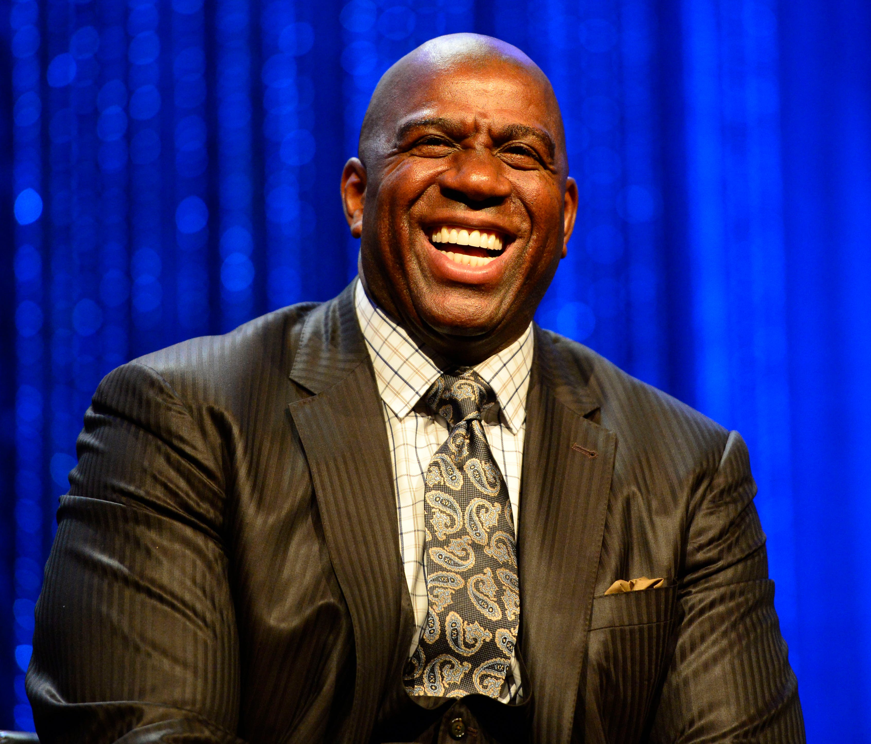 Magic Johnson laughs during the 2014 NBA All-Star Game Legends Brunch.