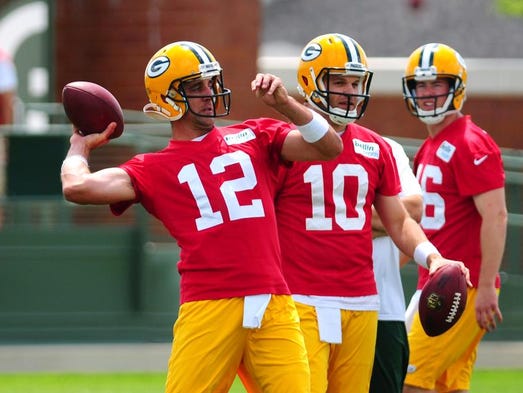 Green Bay Packers quarterbacks Aaron Rodgers, left, Matt Flynn, center, and Scott Tolzien go through drills during minicamp practice at Ray Nitschke Field, Tuesday, June 17, 2014. H. Marc Larson/Press-Gazette Media