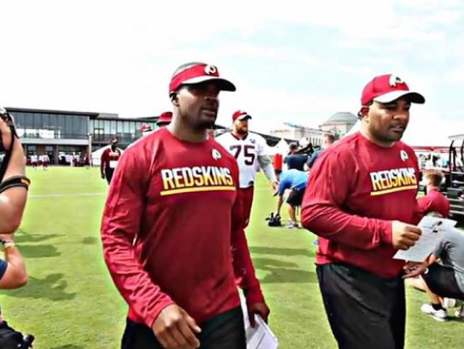 Riverdale assistant football coach William Henry (center) was able to coach a week of training camp with the Washington Redskins.