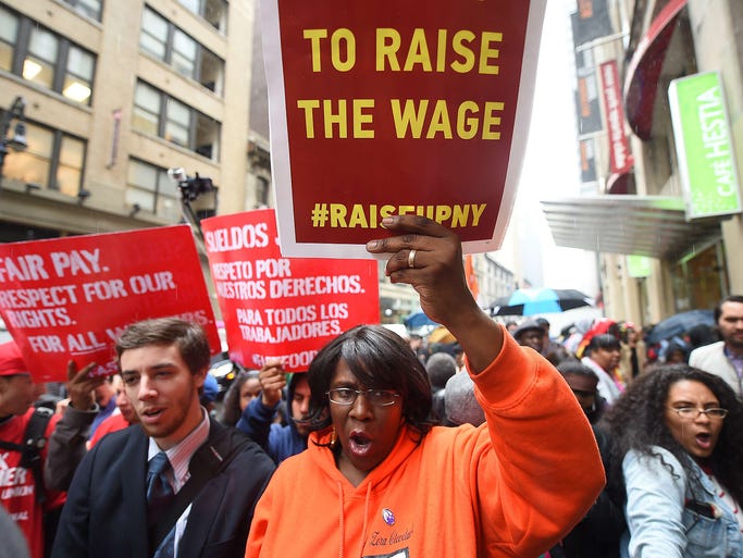 Fast-food workers stage a demonstration for a higher minimum wage on May 15 in New York City. Fast-food workers around the world staged a global protest to demand an increase of their minimum wage to $15 an hour.