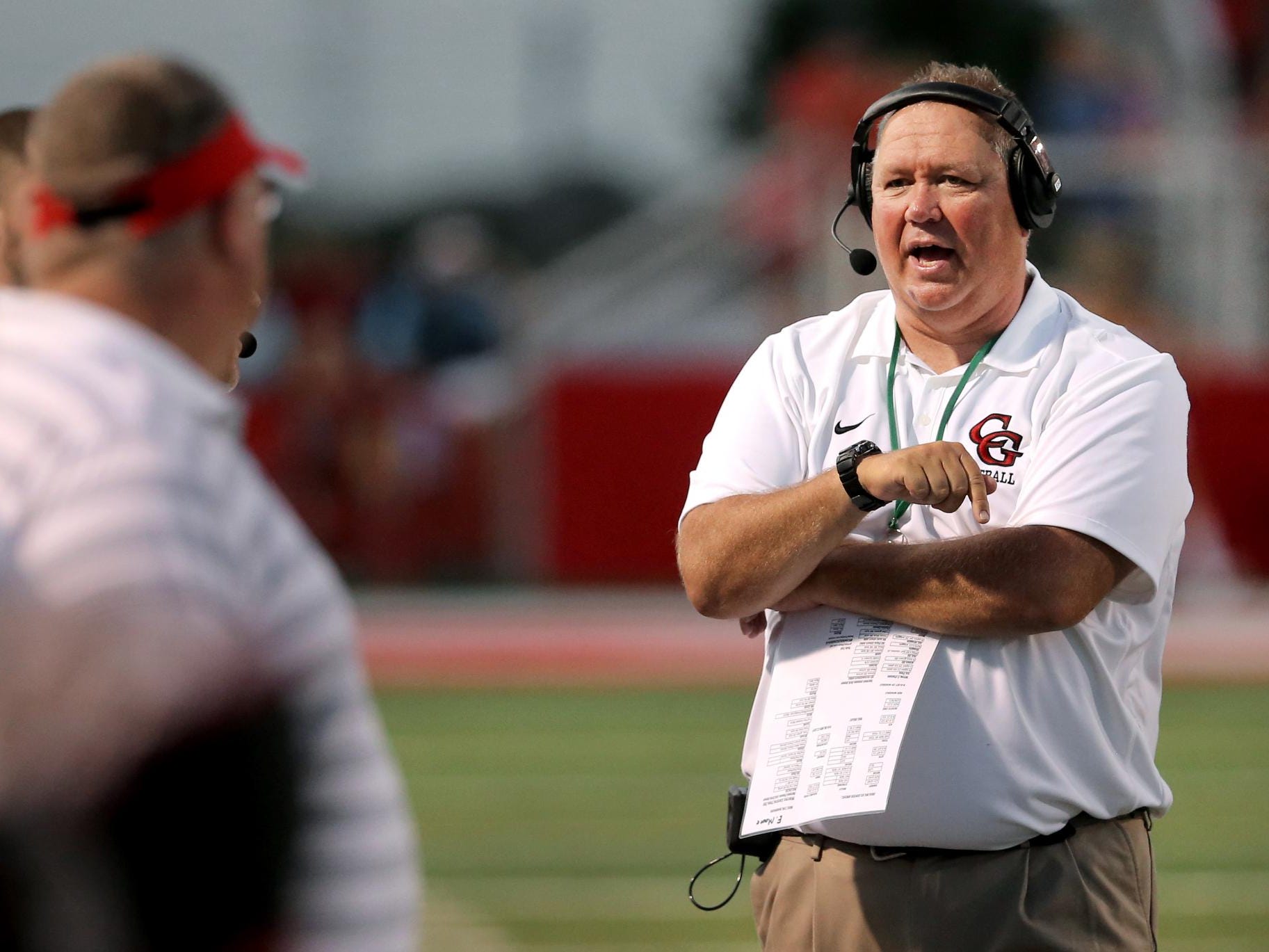 Center Grove head coach Eric Moore and some other area football coaches are trying to protect players’ heads by changing how they tackle.