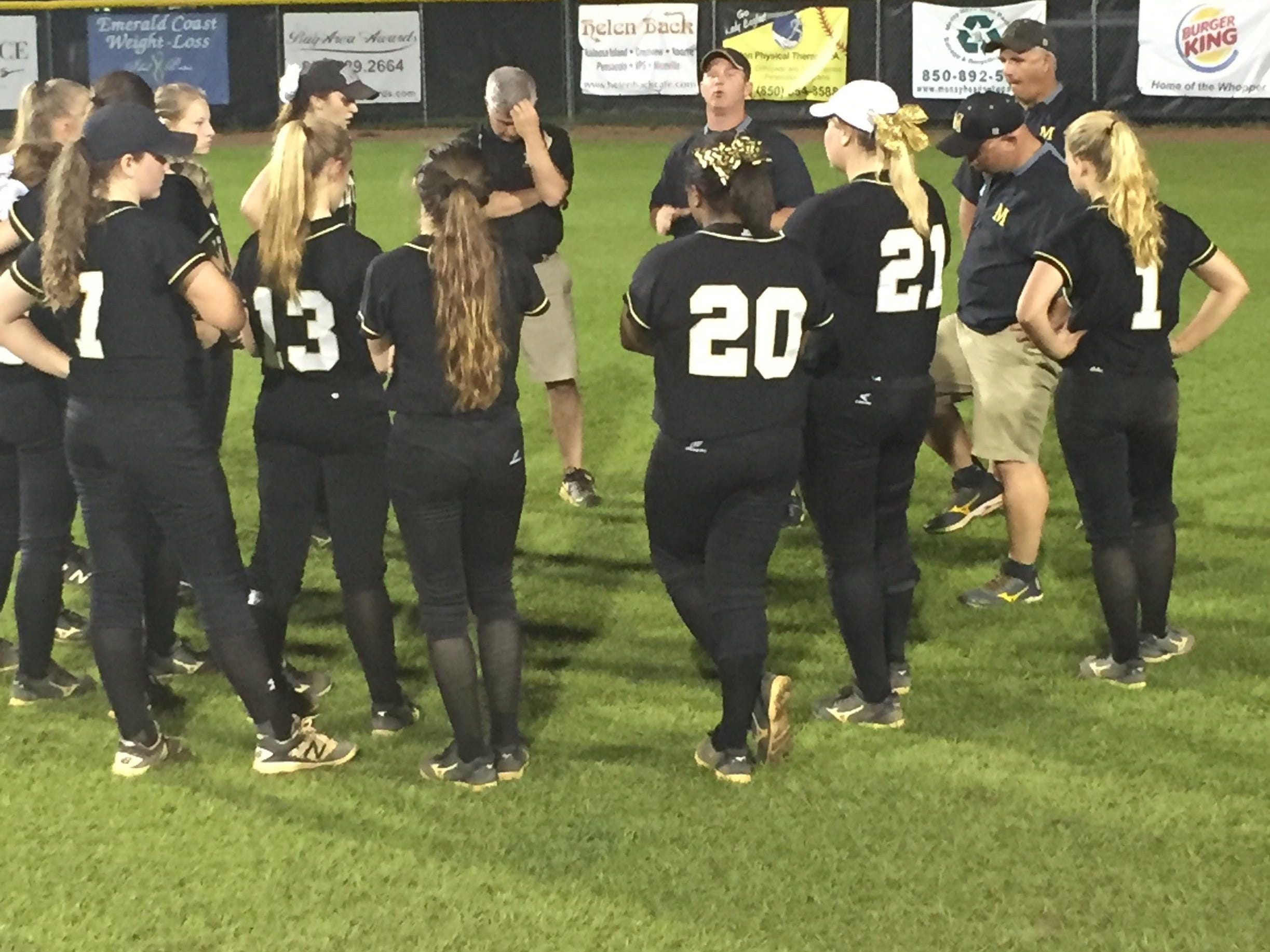 The Milton Panthers gather as a team following Tuesday night’s Region 1-7A semifinal loss at Niceville.
