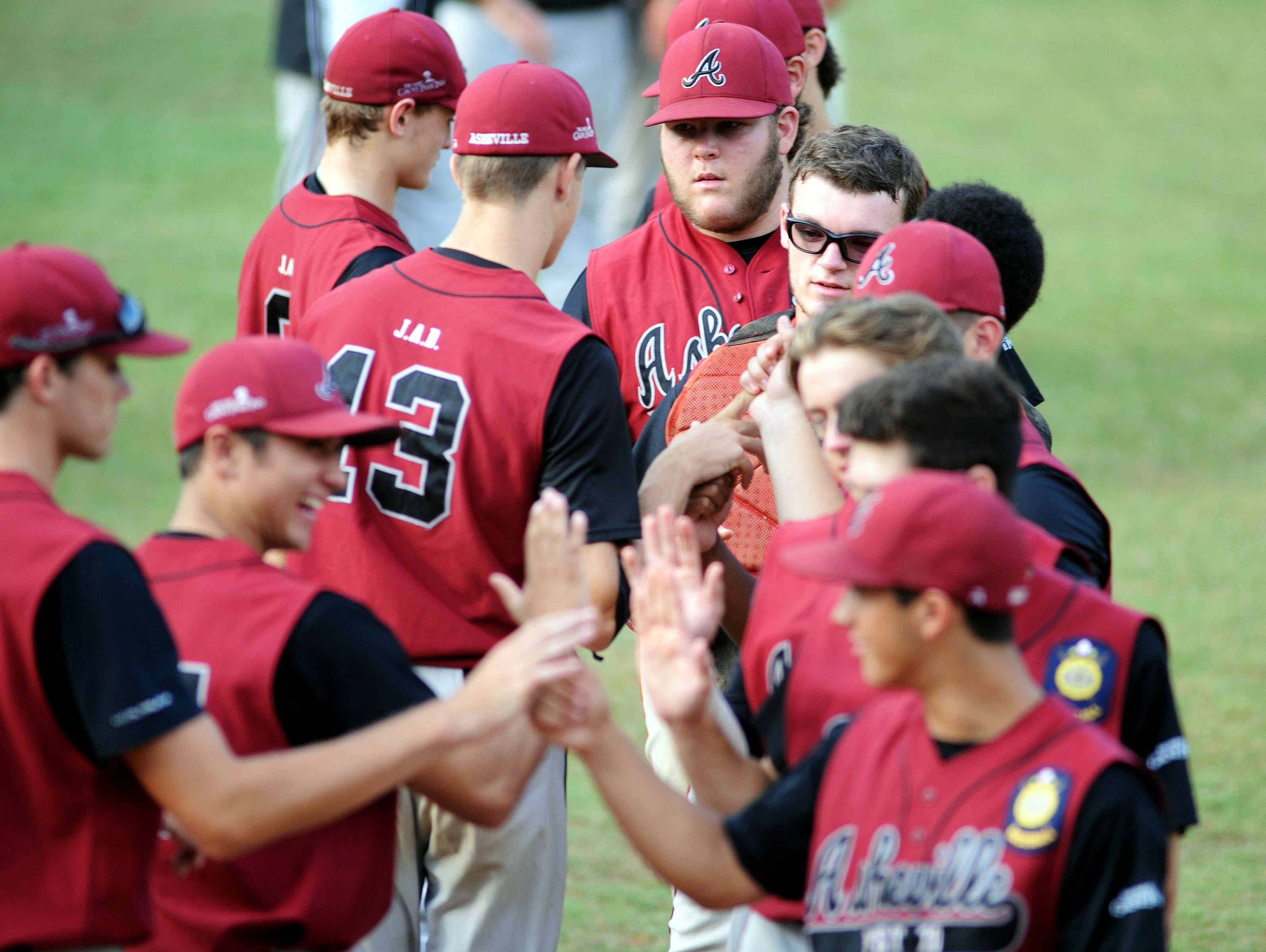 Asheville American Legion Post 70 players shake hands following a 2015 game.