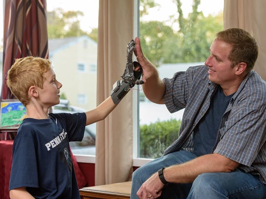 Colin Consavage, 10, of Claymont and his father, Joseph,