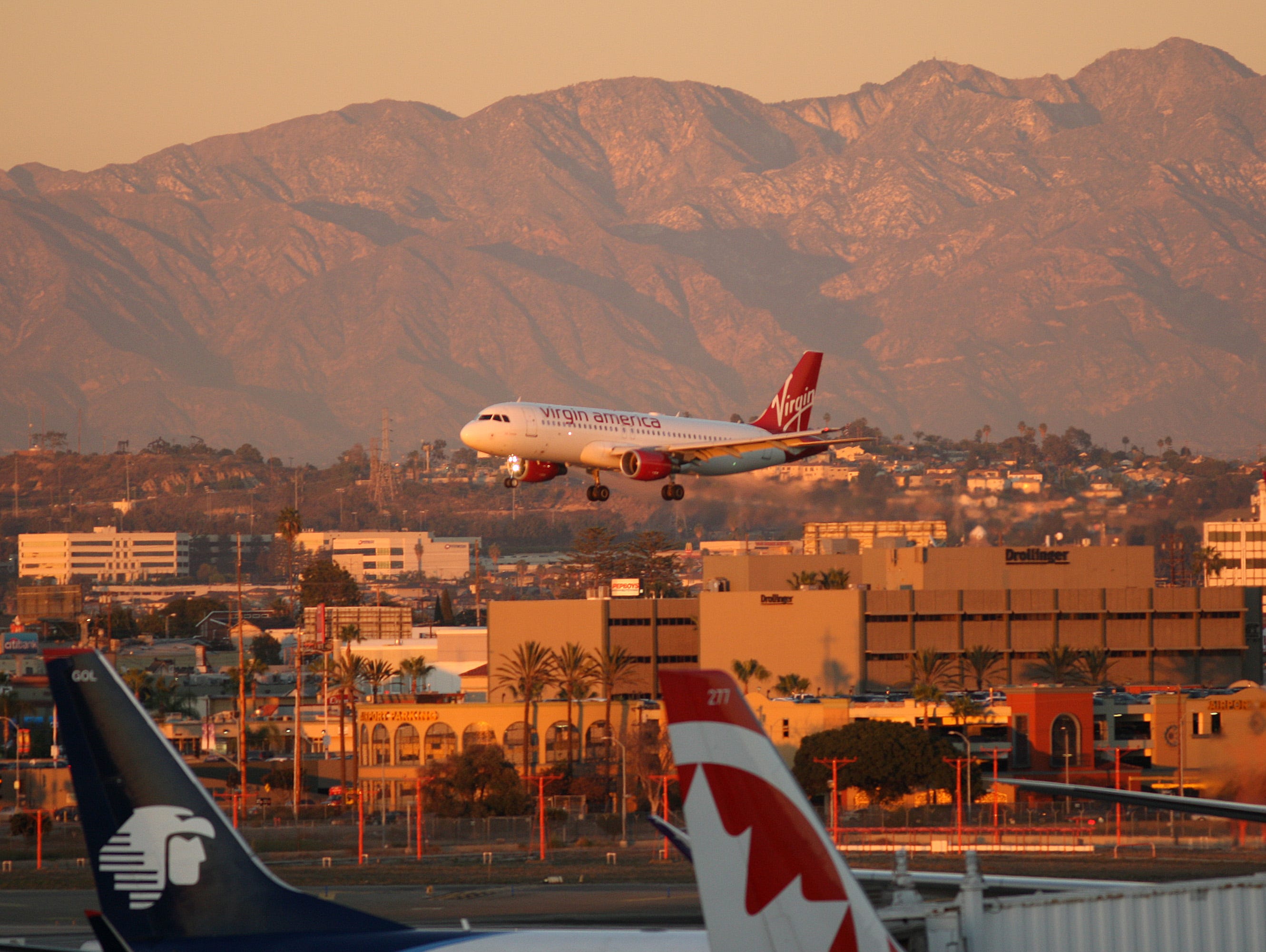 A Virgin America jet lands at LAX on Nov. 26, 2014.