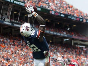 Melvin Ray hauled in a red zone touchdown in overtime to help Auburn avoid upset by Jacksonville State.