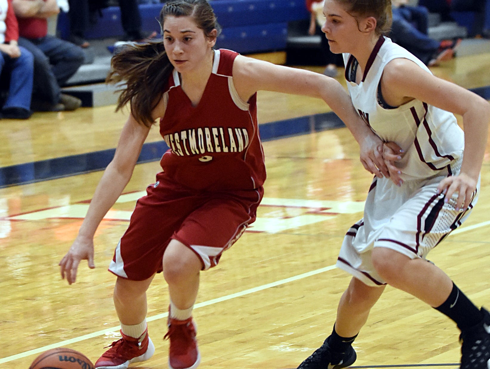 Westmoreland High junior point guard Gracie Oliver dribbles to the basket as Cheatham County freshman Emmy Nelson defends. Oliver scored four points.