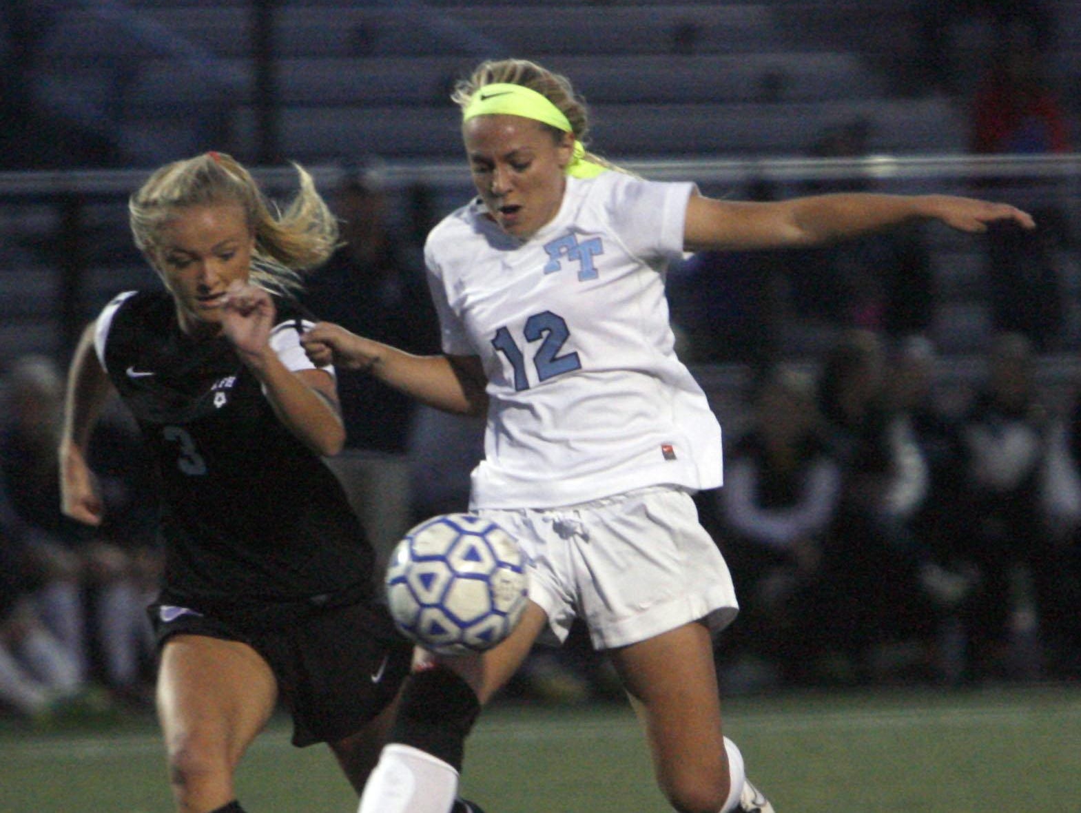 Rumson-Fair Haven's Jacqueline Littleson, left and Freehold Township's Lacey Powell (12) fight for control in the SCT Semifinal at Toms River North High School October 29, 2015.
