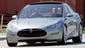 Tesla Motors Chairman, CEO and Product Architect Elon Musk, at the wheel, right, and chief designer Franz von Holzhausen take the prototype Tesla Model S all-electric 5-door sedan for a spin after its unveiling in Hawthorne, Calif., Thursday, March 26, 2009.  (AP Photo/Reed Saxon)