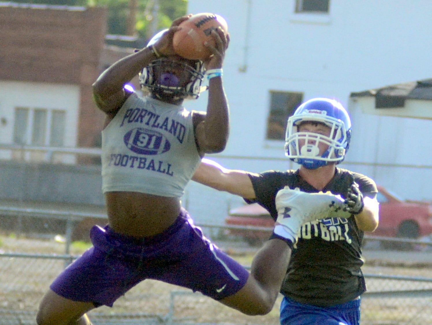 Portland High senior Emmanuel Johnson leaps to catch a pass against Macon County during Trousdale County’s 7-on-7 workouts on Tuesday afternoon.