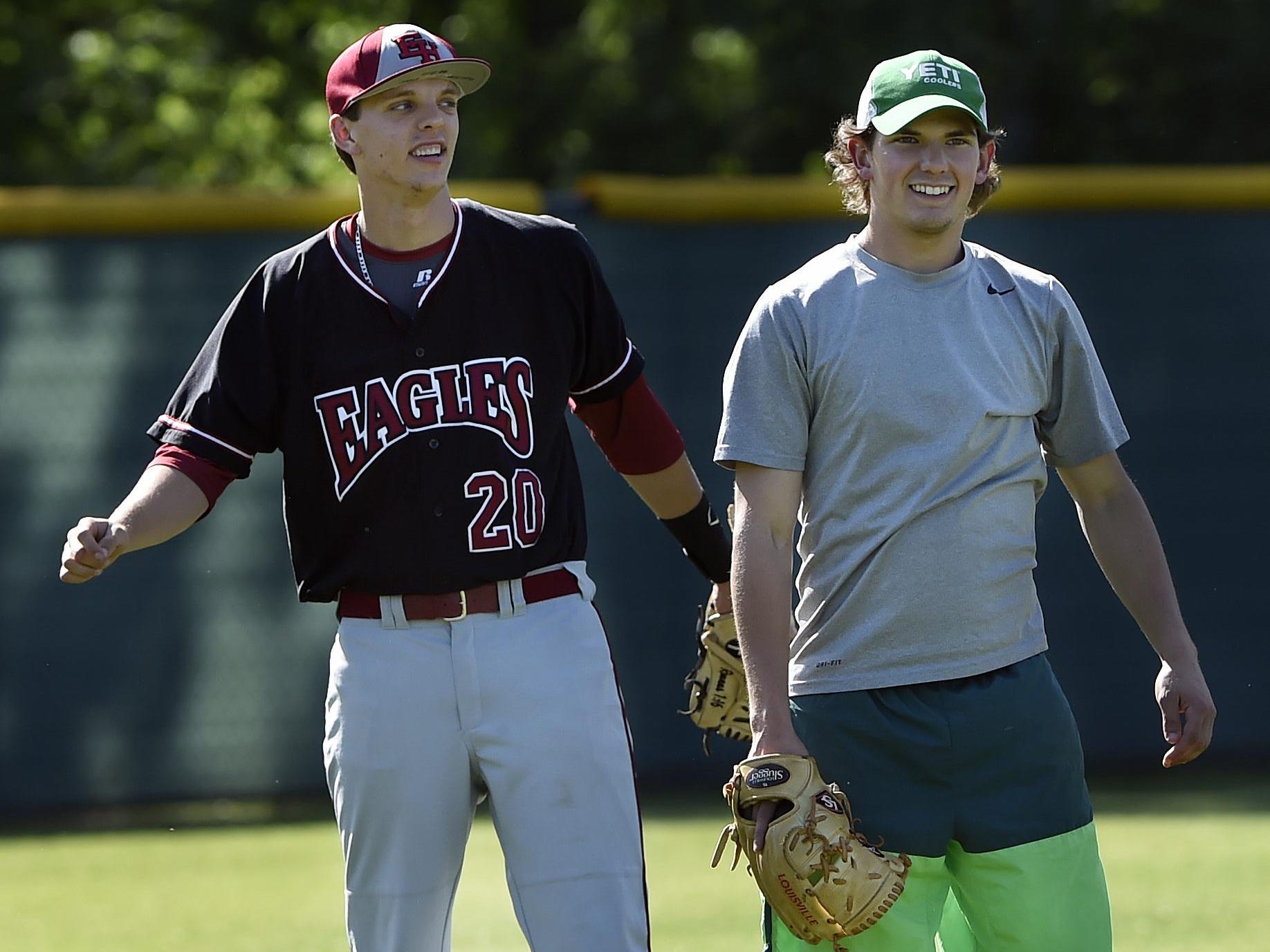Ezell-Harding Christian School pitcher and third baseman, Grant Phillips, left, and pitcher Seth Wyse warm up before a game baseball game on Thursday, April 28, 2016, in Nashville, Tenn. Wyse could not play as because of an ankle injury.