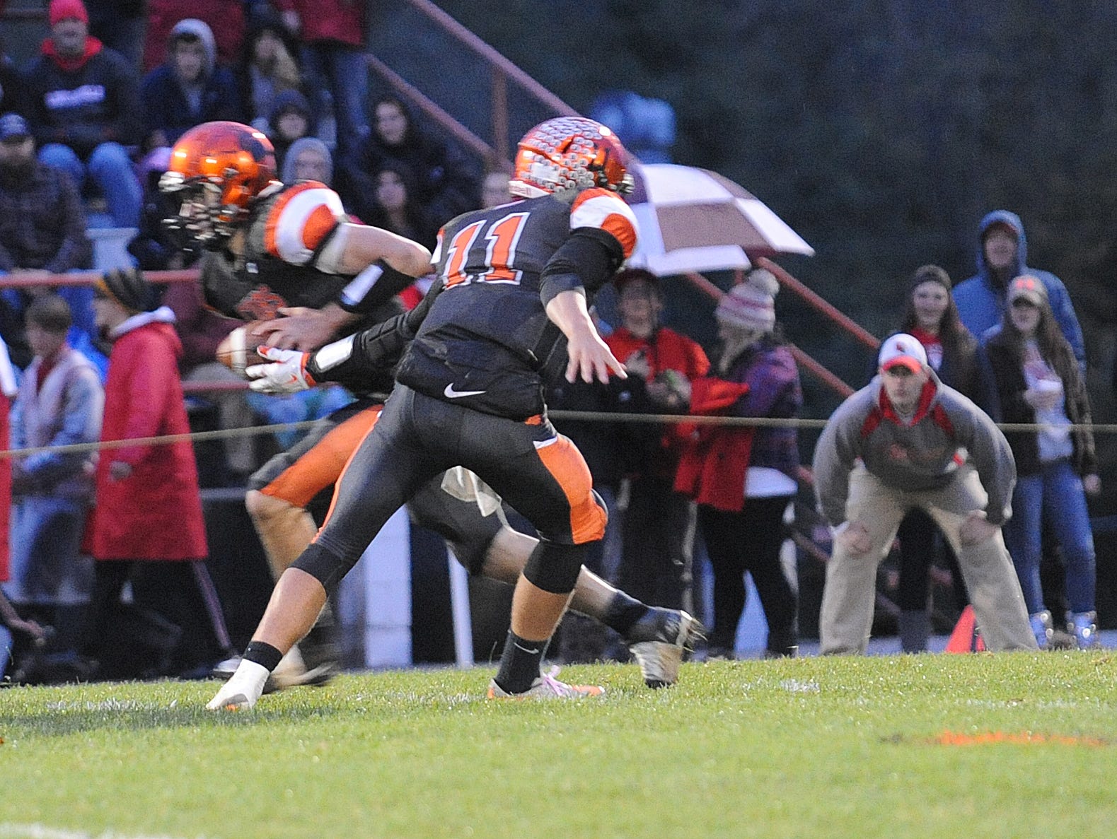 Lucas quarterback Rueben Luna hands off to running back Mason Galco against Loudonville. For the second straight year, the Cubs are in the playoffs and they will host a game Friday night at 7:30 p.m.