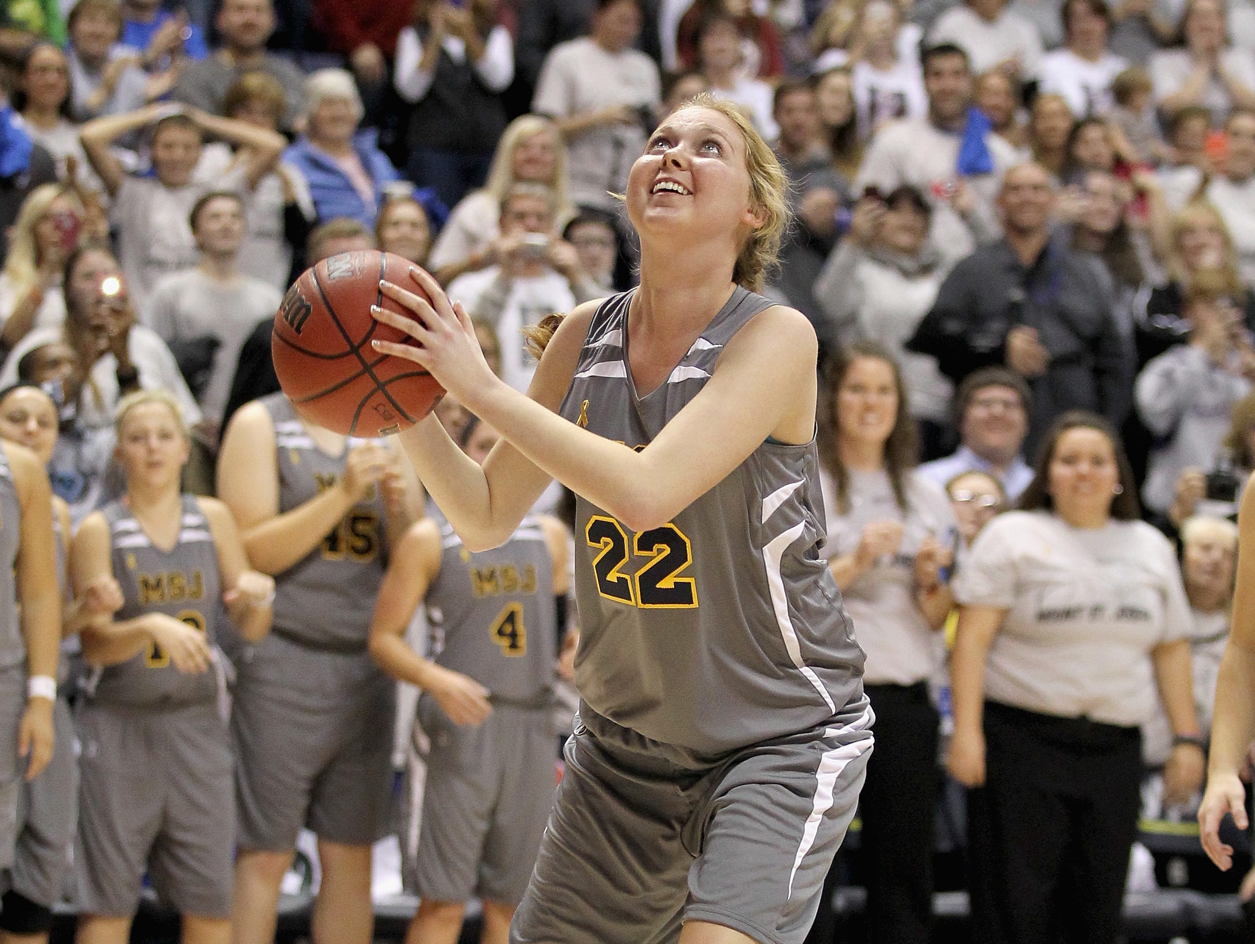 Lauren Hill of Mount St. Joseph shoots to score her second basket during the game against Hiram at Cintas Center on November 2, 2014 in Cincinnati, Ohio.