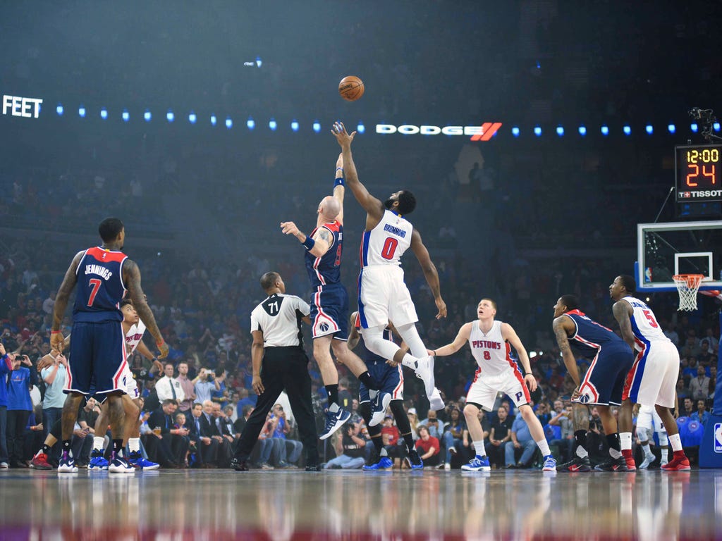  Washington Wizards center Marcin Gortat, left, and Detroit Pistons center Andre Drummond battle for the ball during the opening tip off at The Palace of Auburn Hills, Mich.