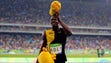 Usain Bolt (JAM) celebrates after winning the gold