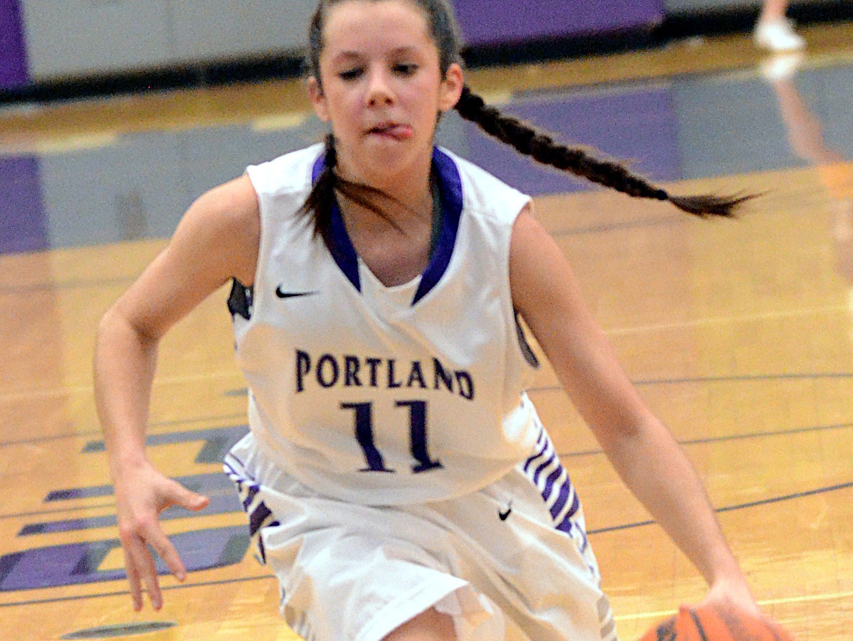 Portland High sophomore point guard Rachel Jennings dribbles into the lane during second-quarter action. Jennings scored five points.