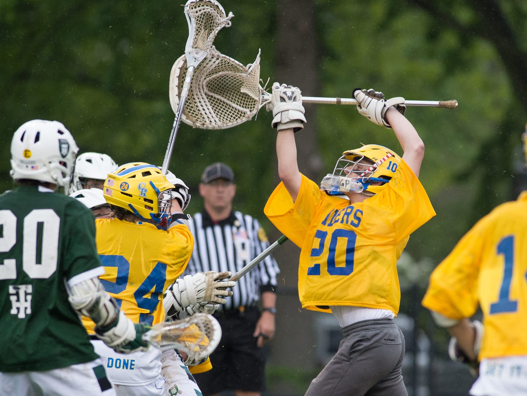 Caesar Rodney's goalie Tyler Gross reaches to stop a shot in their home game against Tower Hill.