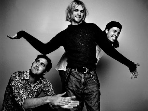 Krist Novoselic, left, Kurt Cobain, and Dave Grohl of Nirvana, one of 16 artists nominated for Rock and Roll Hall of Fame induction.
