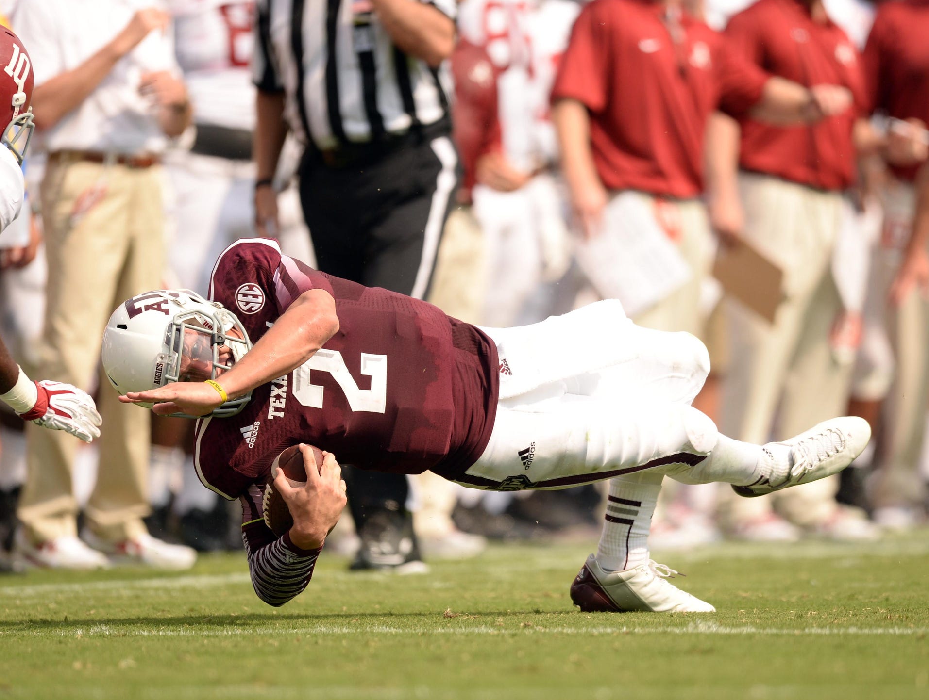 Texas A&M Aggies quarterback Johnny Manziel (2) dives for extra yards against the Alabama Crimson Tide during the first half at Kyle Field.