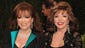 Actress Joan Collins, right, poses with her sister,