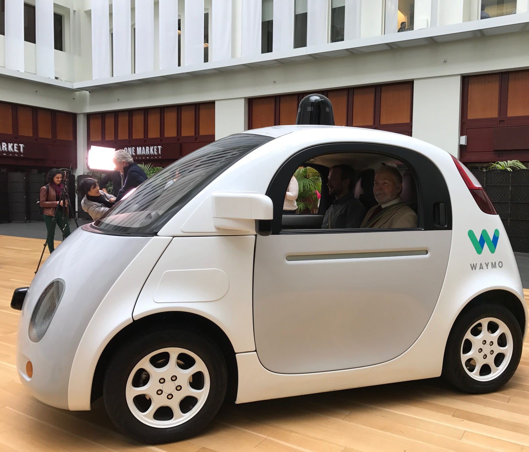 Waymo, the newly renamed Google self-driving car company, showed off its two seat prototype and new logo in the lobby of a San Francisco building Tuesday.