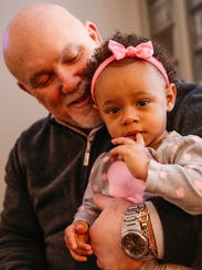 Gar King, father of Jordan King, holds his 17-month-old