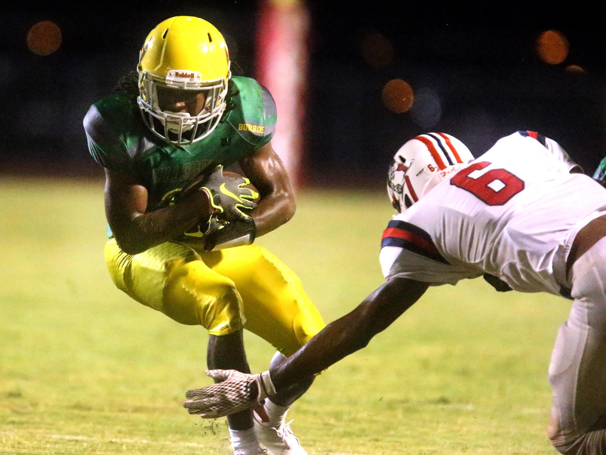 Hillsboro's Barrion Claybrooks (7) runs the ball as Oakland's Kaleb Oliver (6) moves in for the tackle, on Friday, Aug. 26, 2016.