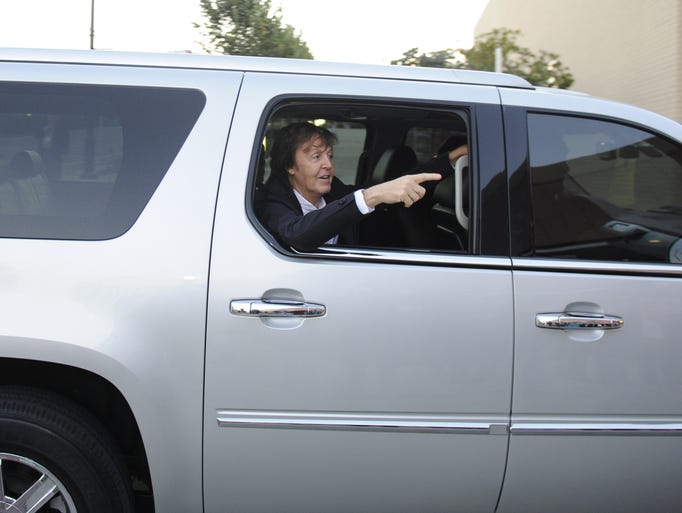 Paul McCartney waves to fans before his Nashville concert.