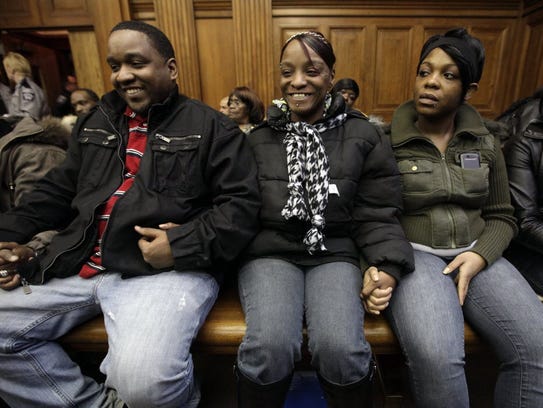 Derek Williams' mother Sonya Moore (center) reacts