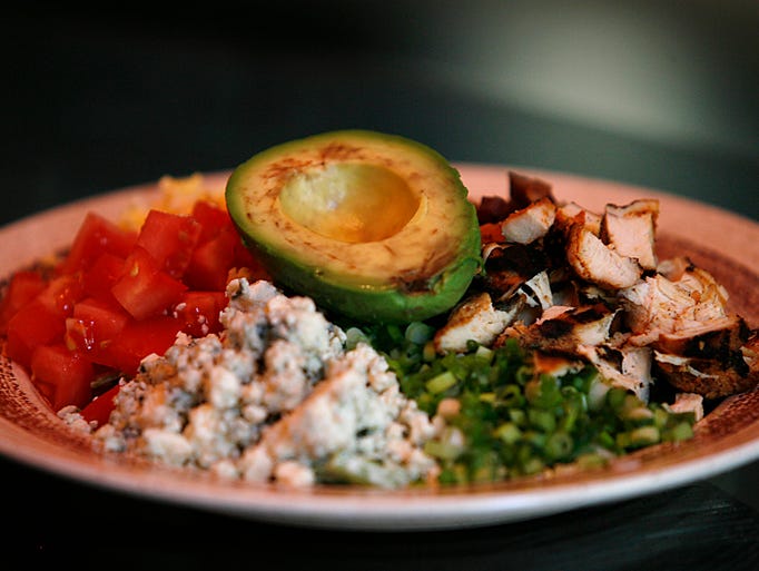 Chef Jay Gundy's Cobb salad features diced tomatoes, blue cheese, scallions, grilled chicken and topped with avocado.