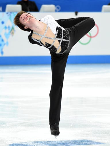 Yakov Godorozha (UKR) performs during the figure skating team men short program in the Sochi 2014 Olympic Winter Games at Iceberg Skating Palace.