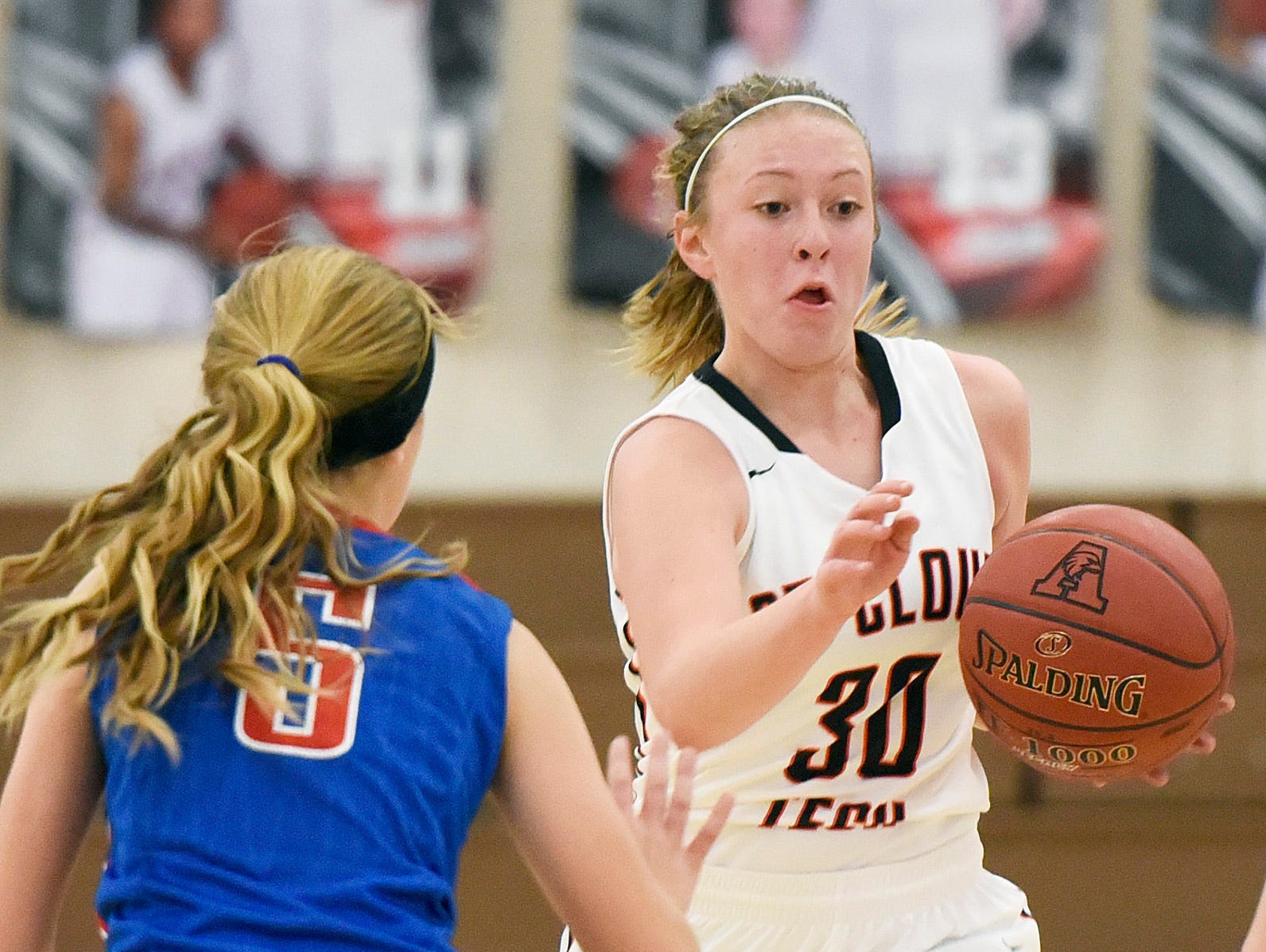 Tech's Abby Wolters breaks past Apollo's Ashley Koepp during the second half Tuesday, Dec. 8 at Apollo High School.