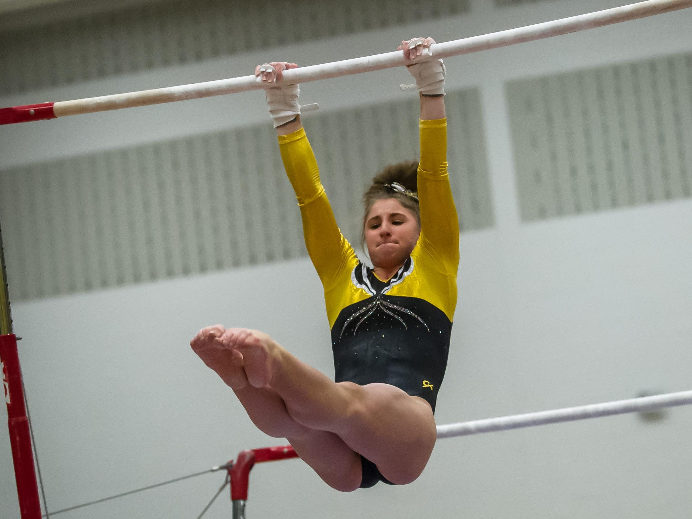 St. John Vianney's Kristen Politz competes on the bars in the NJSIAA Gymnastics state individual championship at Montgomery High School on Saturday Nov. 14, 2015. Photo by Jeff Granit