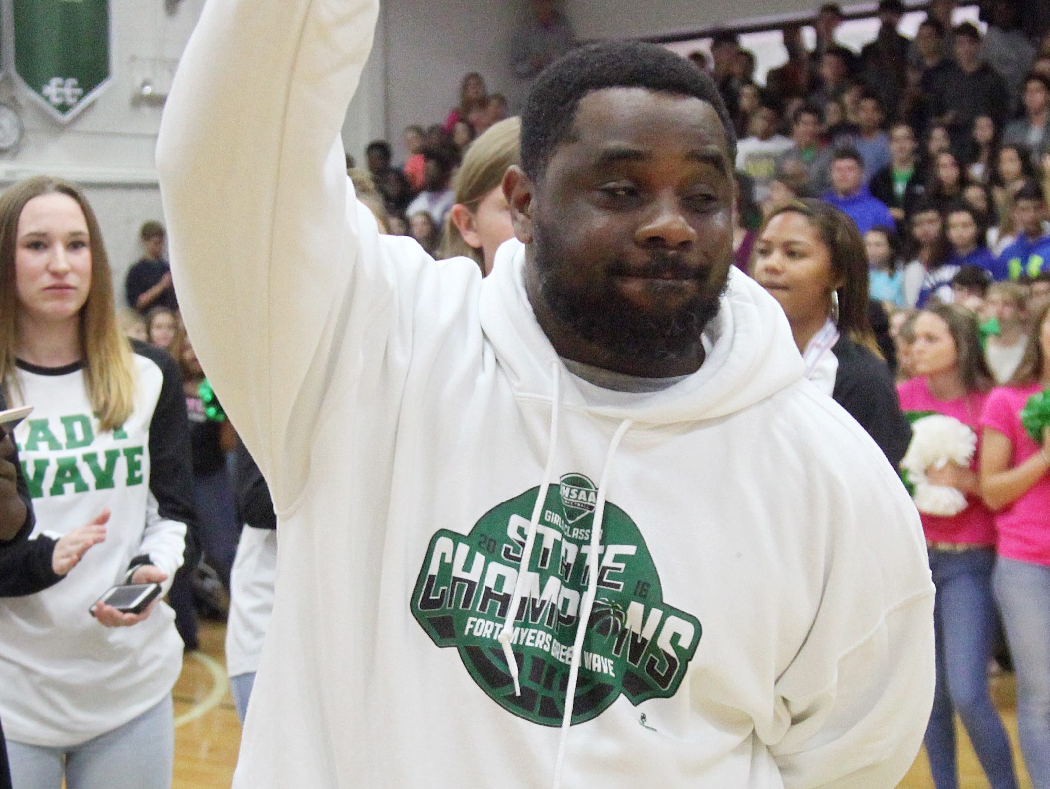 Fort Myers High School girls basketball coach Chad Terrell waves to fans during a pep rally to honor the state championship team on Tuesday. Fort Myers High School girls basketball coach Chad Terrell waves to fans during a pep rally to honor the team on Tuesday.